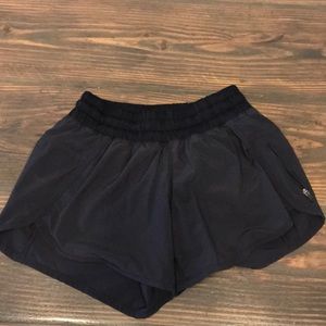 Black size 4 track that lululemon shorts.